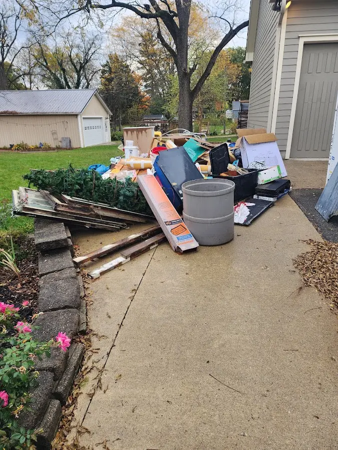 Dumpster being loaded with debris for Residential Dumpster Rental in West Miami